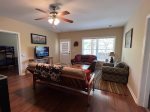 Lower level Den with a flat screen tv streaming only with access to the lower level porch